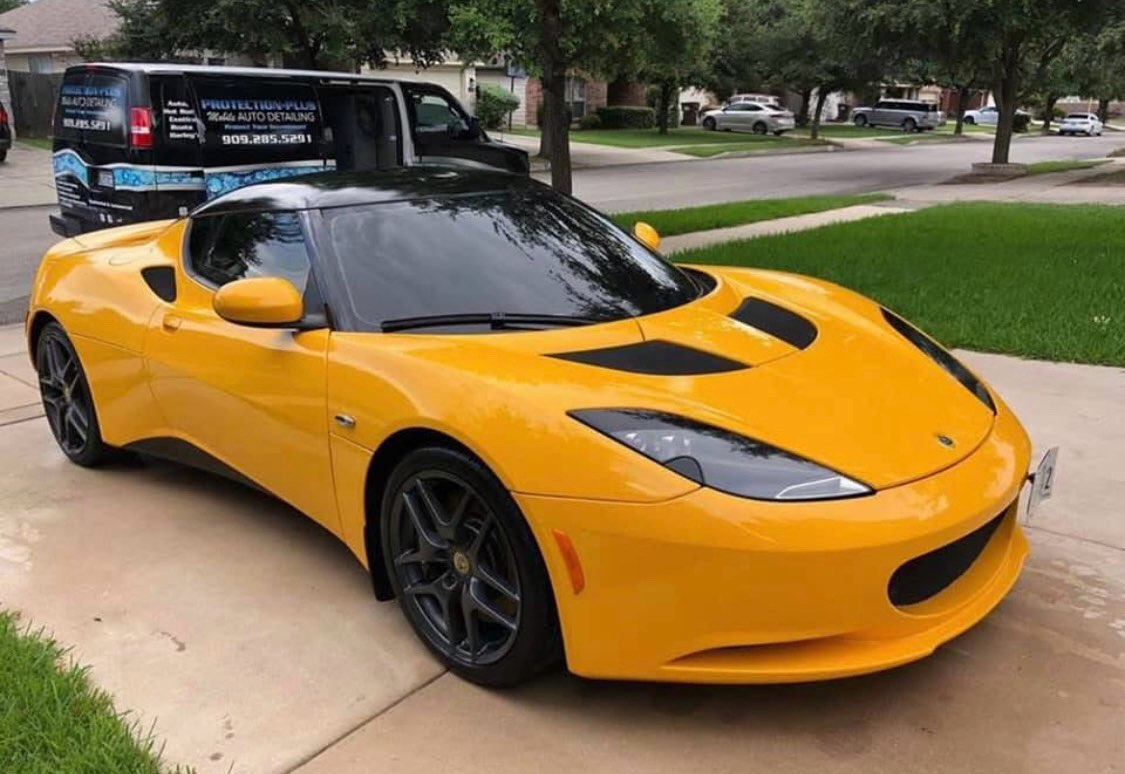 Yellow Lotus Evora detailed in the driveway