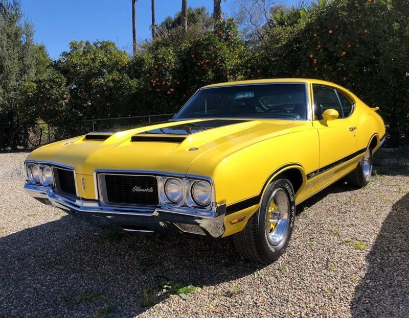 Yellow Oldsmobile 442 with a bright, protected finish