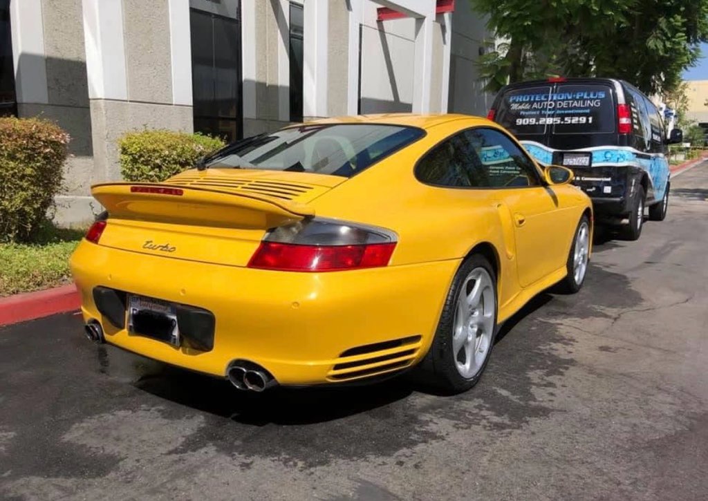 Yellow Porsche 911 Turbo detailed on location