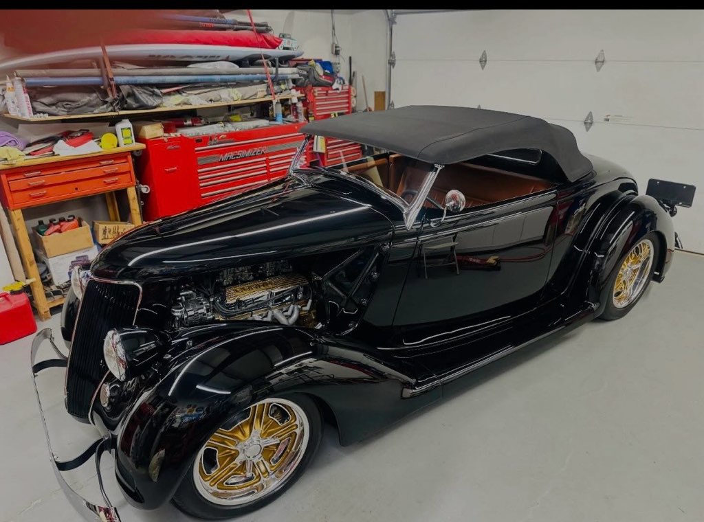 Black classic roadster with a deep mirror gloss, detailed by Protection Plus